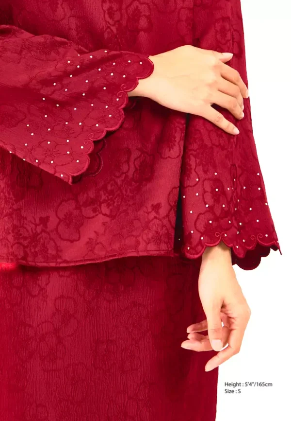 gene-martino-1950-2551554-5.jpg.webp Elegance Redefined: Embroidered Red Kurung